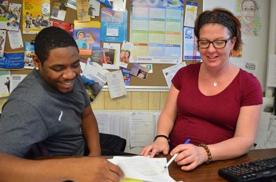 Two people looking at a document